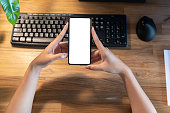 woman holding smartphone with blank screen