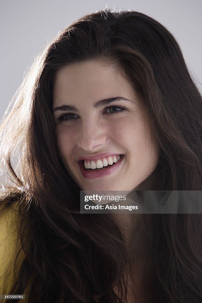 Portrait of laughing brunette woman