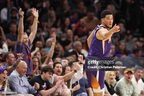 Devin Booker of the Phoenix Suns reacts to a three-point shot against the Oklahoma City Thunder during the first half of the NBA game at Footprint...