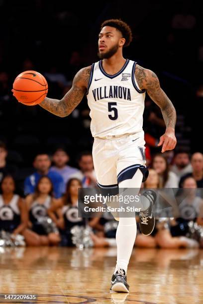 Justin Moore of the Villanova Wildcats dribbles during the second half against the Georgetown Hoyas in the first round of the Big East Basketball...