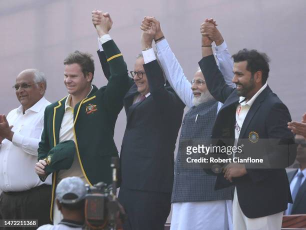 Australian Prime Minister Anthony Albanese and Indian Prime Minister Narendra Modi pose with Australian captain Steve Smith and Indian captain Rohit...