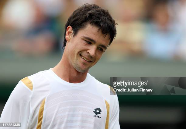 Jamie Baker of Great Britain reacts during his Gentlemen's Singles first round match against Andy Roddick of USA on day three of the Wimbledon Lawn...