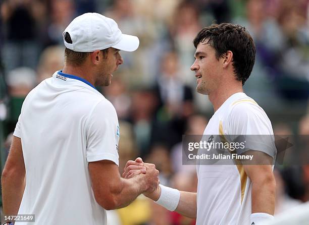 Andy Roddick of USA is congratulated by Jamie Baker of Great Britain after their Gentlemen's Singles first round match on day three of the Wimbledon...