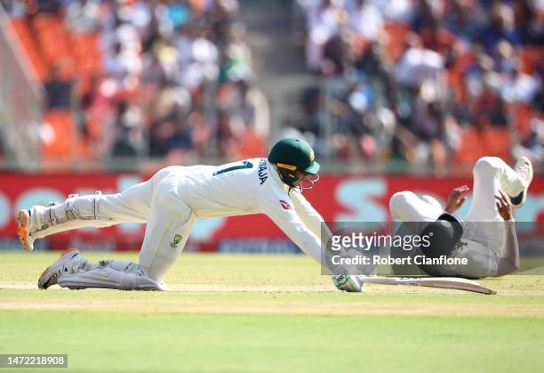 Usman Khawaja of Australia dives for his crease during day one of the Fourth Test match in the series between India and Australia at Narendra Modi...