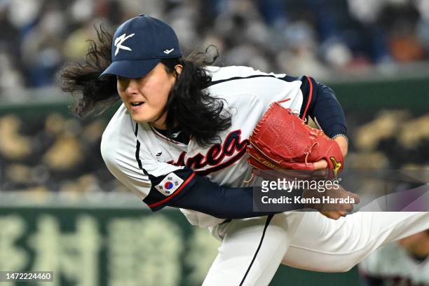 Won Jung Kim of Korea throws in the seventh inning during the World Baseball Classic Pool B game between Australia and Korea at Tokyo Dome on March...