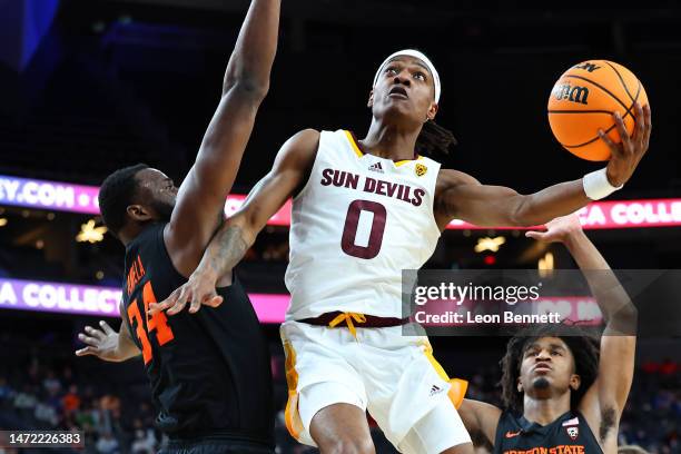 Horne of the Arizona State Sun Devils goes to the basket against Rodrigue Andela of the Oregon State Beavers in the first half during round one of...