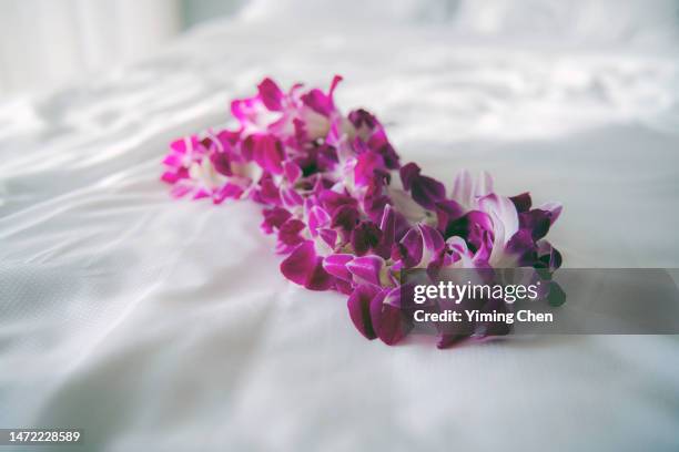 lei made of purple orchids - orchids oahu stock pictures, royalty-free photos & images