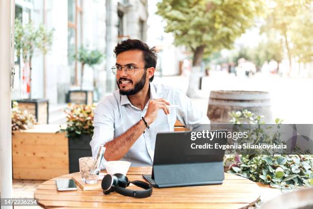 asian businessman working in the cafe outdoors in the summer. - business smartphone happy spring fotografías e imágenes de stock