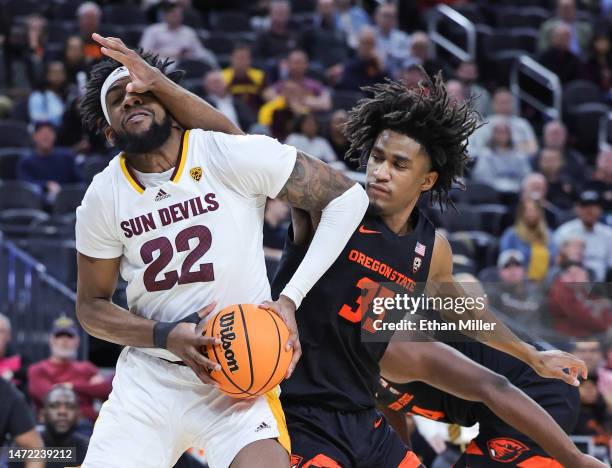 Warren Washington of the Arizona State Sun Devils is fouled by Glenn Taylor Jr. #35 of the Oregon State Beavers in the second half of a first-round...