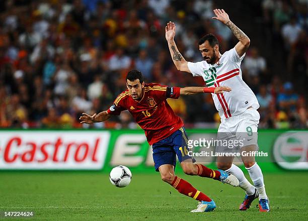 Sergio Busquets of Spain competes with Hugo Almeida of Portugal during the UEFA EURO 2012 semi final match between Portugal and Spain at Donbass...
