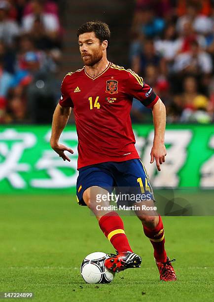 Xabi Alonso of Spain in action during the UEFA EURO 2012 semi final match between Portugal and Spain at Donbass Arena on June 27, 2012 in Donetsk,...