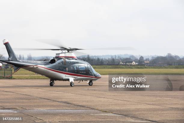 executive helicopter with engine running on airfield tarmac - helicopter blades stock pictures, royalty-free photos & images