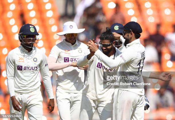 Ravindra Jadeja of India celebrates taking the wicket of Steve Smith of Australia during day one of the Fourth Test match in the series between India...