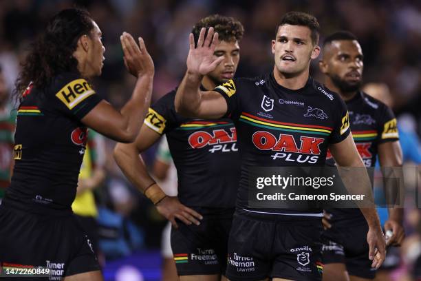 Jarome Luai and Nathan Cleary of the Panthers of the Panthers celebrate after a try by team mate Izack Tago of the Panthers during the round two NRL...