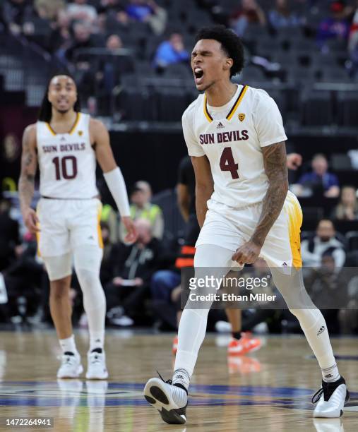 Frankie Collins and Desmond Cambridge Jr. #4 of the Arizona State Sun Devils react in the first half of a first-round game of the Pac-12 basketball...