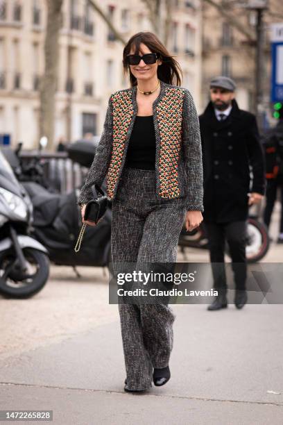 Caroline de Maigret wears a decorated jacket with matching trousers, Chanel bag, outside Chanel, during Paris Fashion Week - Womenswear Fall Winter...