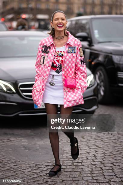 Paris, France - March 5, 2019: Street Style - Woman Wearing Wearing A White  Shirt, Light Blue Pants, Black Heels, Light Blue Hat And Printed Chanel  Bag, Before A Fashion Show During