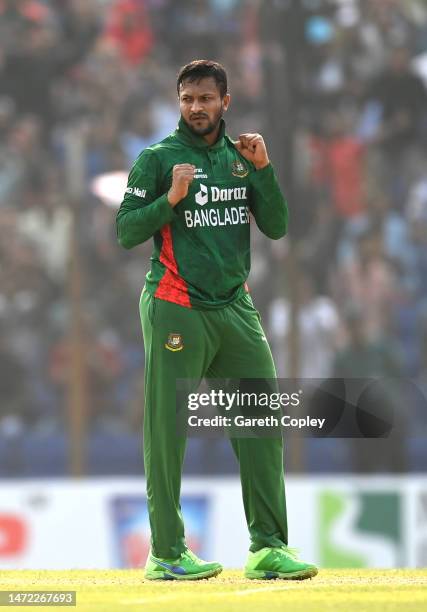 Bangladesh bowler Shakib Al Hasan celebrates after taking the wicket of England batsman Dawid Malan during the 1st T20 International between...