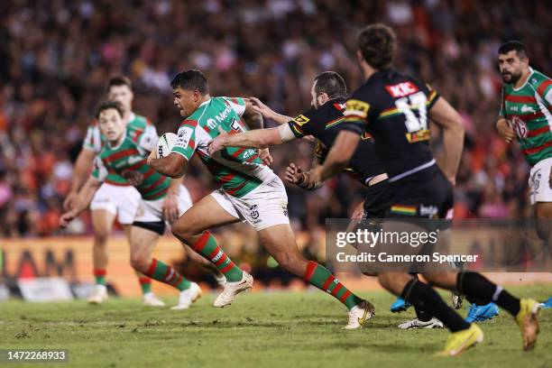 Latrell Mitchell of the Rabbitohs Is tackled by Isaah Yeo of the Panthers during the round two NRL match between the Penrith Panthers and the South...