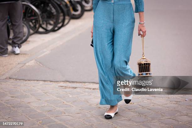 Guest, Chanel bag details, is seen outside Chanel, during Paris Fashion Week - Womenswear Fall Winter 2023 2024, on March 07, 2023 in Paris, France.