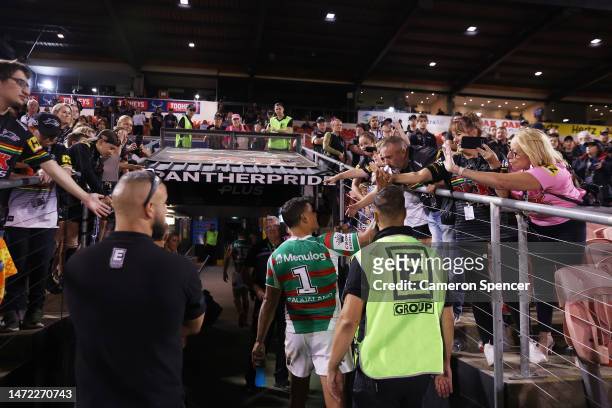 Latrell Mitchell of the Rabbitohs interacts with fans as he walks down the tunnel at the end of the round two NRL match between the Penrith Panthers...
