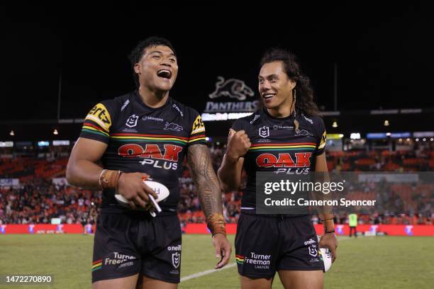 Jarome Luai and Brian To'o of the Panthers smile as they walk from the field following victory in the round two NRL match between the Penrith...