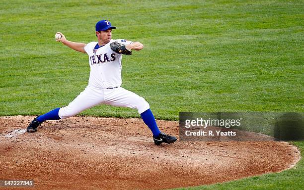 Roy Oswalt of the Texas Rangers throws against the Colorado Rockies during the interleague game at Rangers Ballpark in Arlington on June 22, 2012 in...