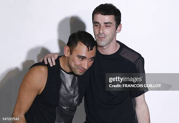 Japanese-Italian designer Nicola Formichetti and collection designer Sebastien Teigne for the label Mugler acknowledges the public following the...