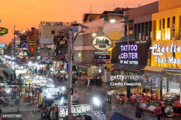 sunset on khao san road in bangkok, thailand - khao san road stock pictures, royalty-free photos & images