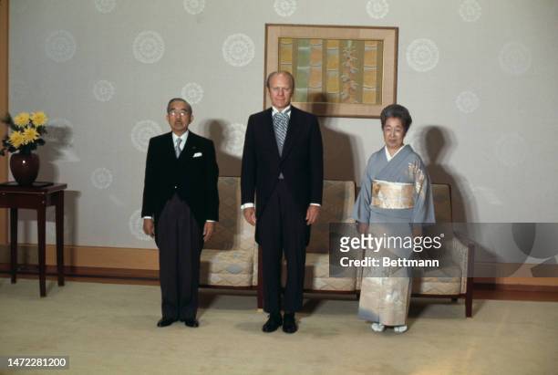 President Gerald Ford poses with Emperor Hirohito and Empress Nagako as he pays an official visit to the Imperial Palace in Tokyo, Japan, on November...