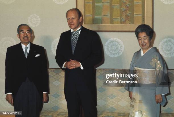 President Gerald Ford poses with Emperor Hirohito and Empress Nagako as he pays an official visit to the Imperial Palace in Tokyo, Japan, on November...