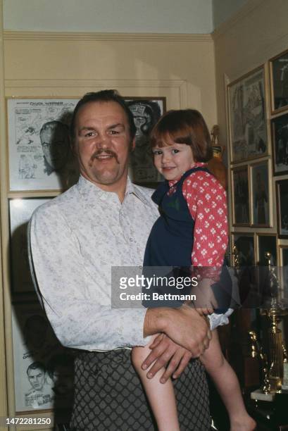 Heavyweight boxer Chuck Wepner holds his daughter Kimberly in Bayonne, New Jersey, on January 23rd after announcing that he plans to fight Muhammad...