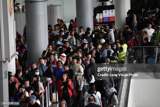 Stranged passengers queue for other airlines after the low-cost airline Viva Air suspended its operations at the El Dorado International Airport in...