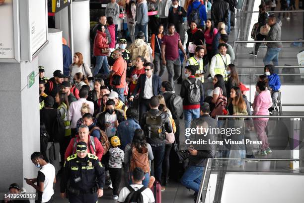 Stranged passengers queue for other airlines after the low-cost airline Viva Air suspended its operations at the El Dorado International Airport in...