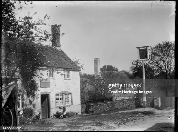 Beacon's Bottom, Stokenchurch, Wycombe, Buckinghamshire, 1919. A beer house and inn sign at Beacon's Bottom with two young girls sitting outside. At...