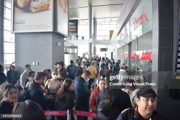 Stranged passengers queue for other airlines after the low-cost airline Viva Air suspended its operations at the El Dorado International Airport in...