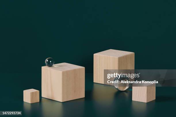 abstract minimal 3d scene showcase with natural wooden cube podiums on deep dark turquoise background. - stage backdrop mockup stock pictures, royalty-free photos & images