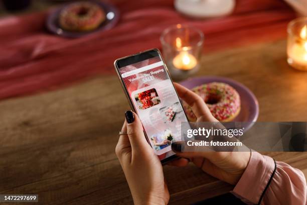 young woman shopping sales online during valentine's day - food advertisement stock pictures, royalty-free photos & images