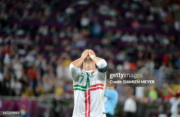 Portuguese forward Cristiano Ronaldo reacts after missing a goal opportunity during the Euro 2012 football championships semi-final match Portugal...