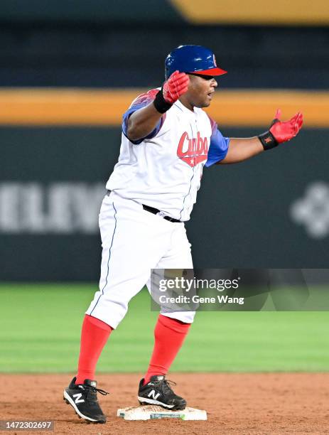 Alfredo Despaigne of Team Cuba hits a double at the bottom of the 8th inning during the World Baseball Classic Pool A game between Italy and Cuba at...