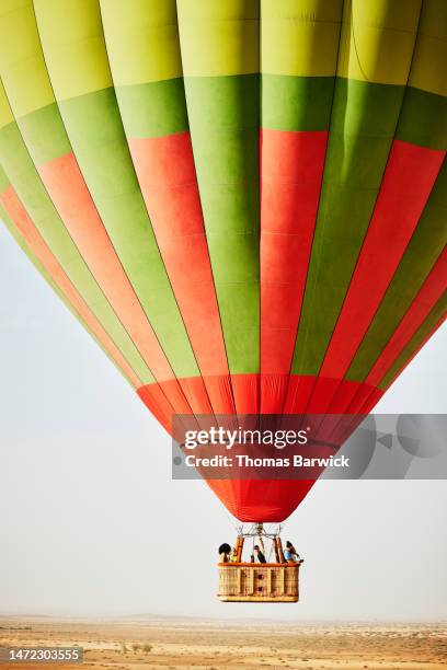 wide shot of family and friends on early morning hot air balloon ride - hot arab women stock-fotos und bilder