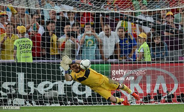 Spanish goalkeeper Iker Casillas stops a shot during the penalty shout out of the Euro 2012 football championships semi-final match Portugal vs Spain...