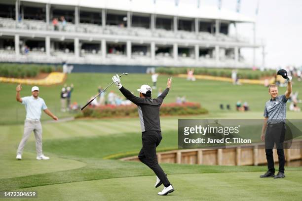 Hayden Buckley of the United States celebrates making a hole-in-one on the 17th hole during the first round of THE PLAYERS Championship on THE...