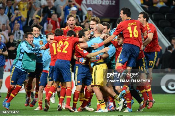 Spanish players celebrate at the end of the penalty shoot out of the Euro 2012 football championships semi-final match Portugal vs. Spain on June 27,...