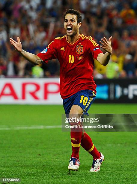 Cesc Fabregas of Spain celebrates scoring the winning penalty during the UEFA EURO 2012 semi final match between Portugal and Spain at Donbass Arena...