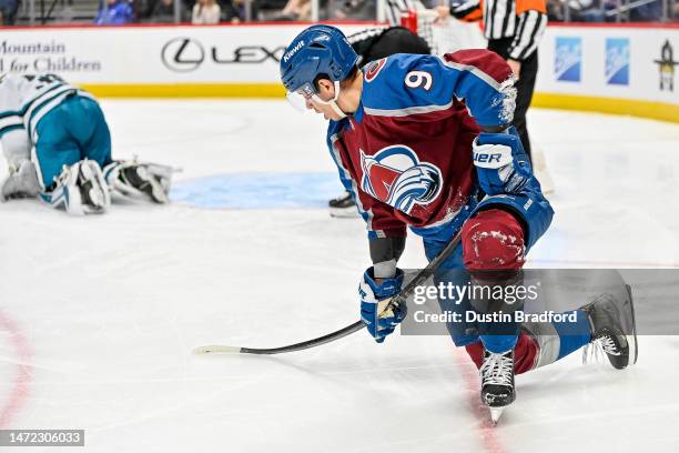 Evan Rodrigues of the Colorado Avalanche uses his stick to lift himself up after falling to the ice on a shot attempt against the San Jose Sharks at...