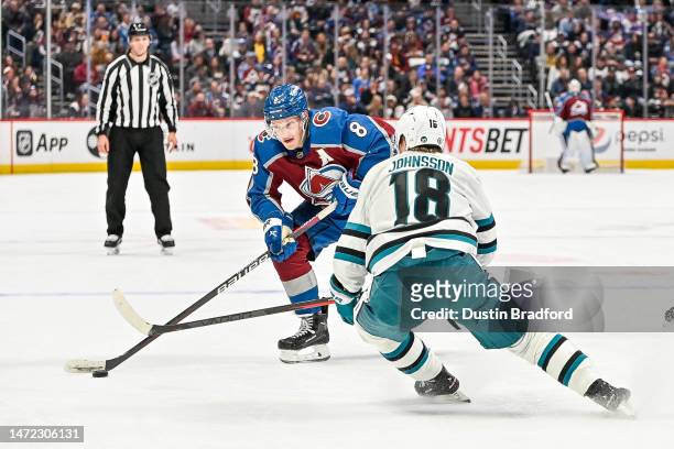 Cale Makar of the Colorado Avalanche is defended by Andreas Johnsson of the San Jose Sharks in a game at Ball Arena on March 7, 2023 in Denver,...