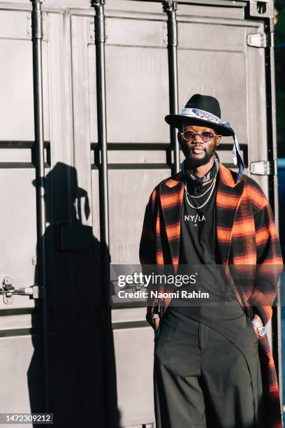 An attendee wears Devil's Advocate coat at Melbourne Fashion Festival on March 09, 2023 in Melbourne, Australia.