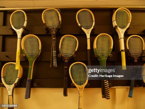 Jesmond Dene Real Tennis Club, Matthew Bank, Jesmond, Newcastle upon Tyne, 2010. A selection of racquets for real tennis hanging on a wall outside...