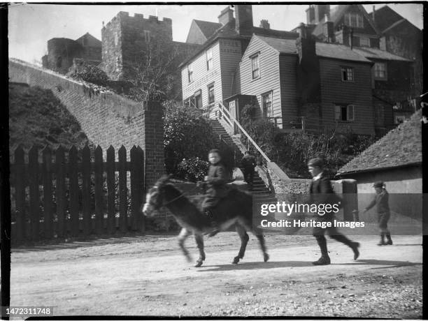 Ypres Castle Inn, Gungarden, Rye, Rother, East Sussex, 1905. A view of the Ypres Castle Inn and steps from the south-east, showing three boys in the...